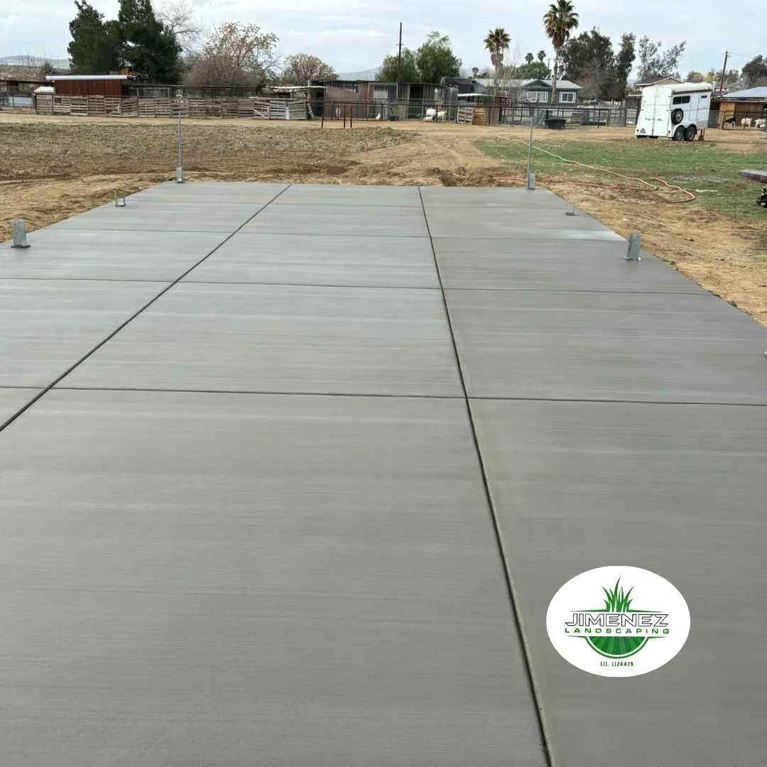 Concrete patio installation by Jimenez Landscaping, showcasing a smooth, durable surface designed for outdoor living spaces in Bakersfield.