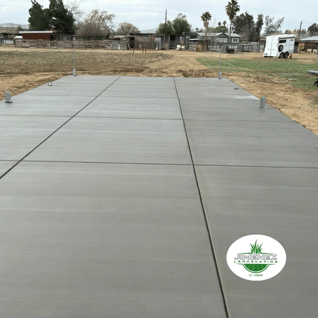 Concrete patio installation by Jimenez Landscaping in Bakersfield, showcasing a smooth, finished surface ready for outdoor use.